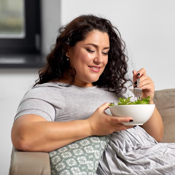 Woman eating salad